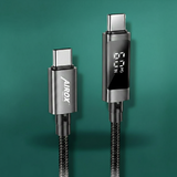 Airox charging cable with digital display on a green background