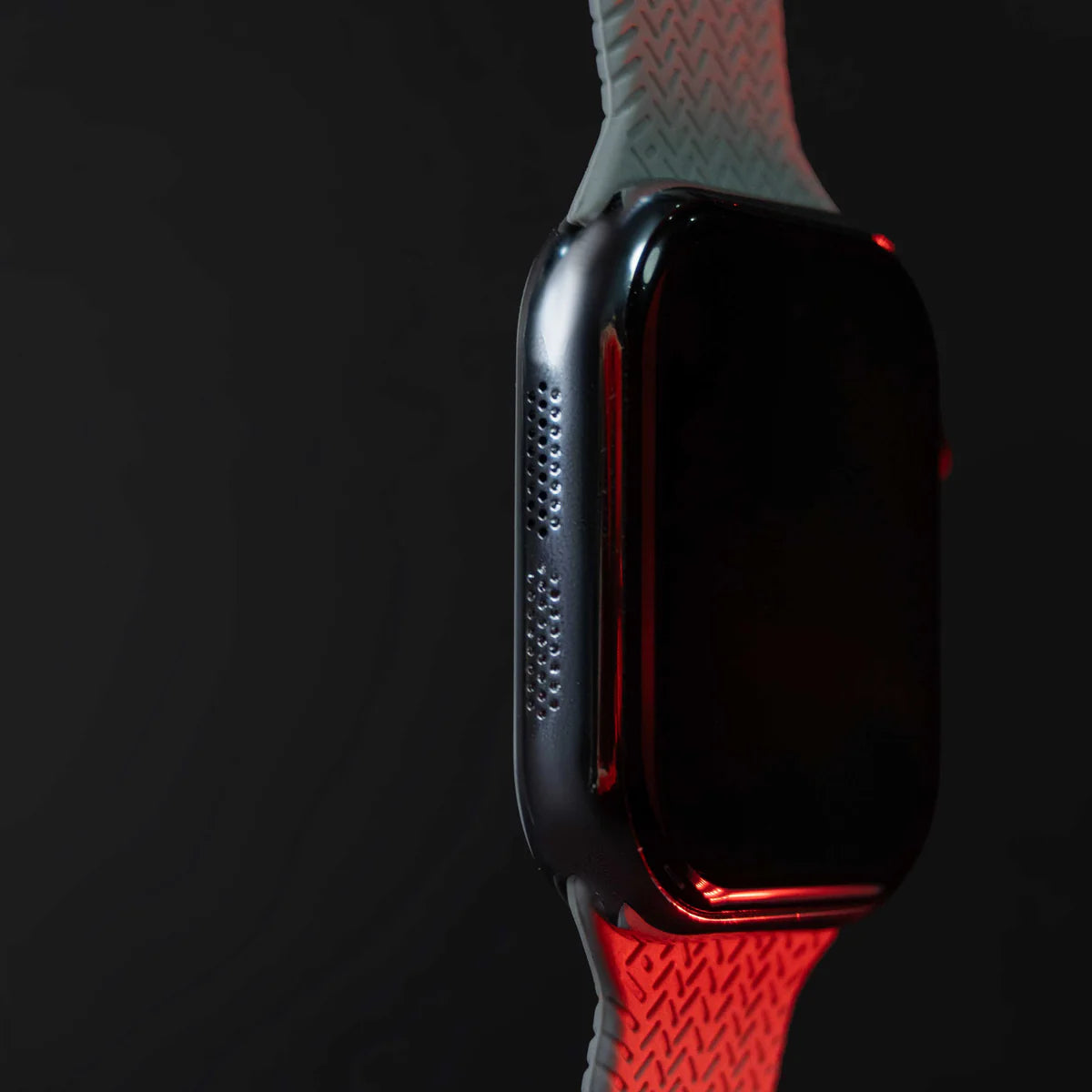 Smartwatch with a red and gray band on a black background