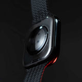 Close-up of a smartwatch with a dark strap on a black background